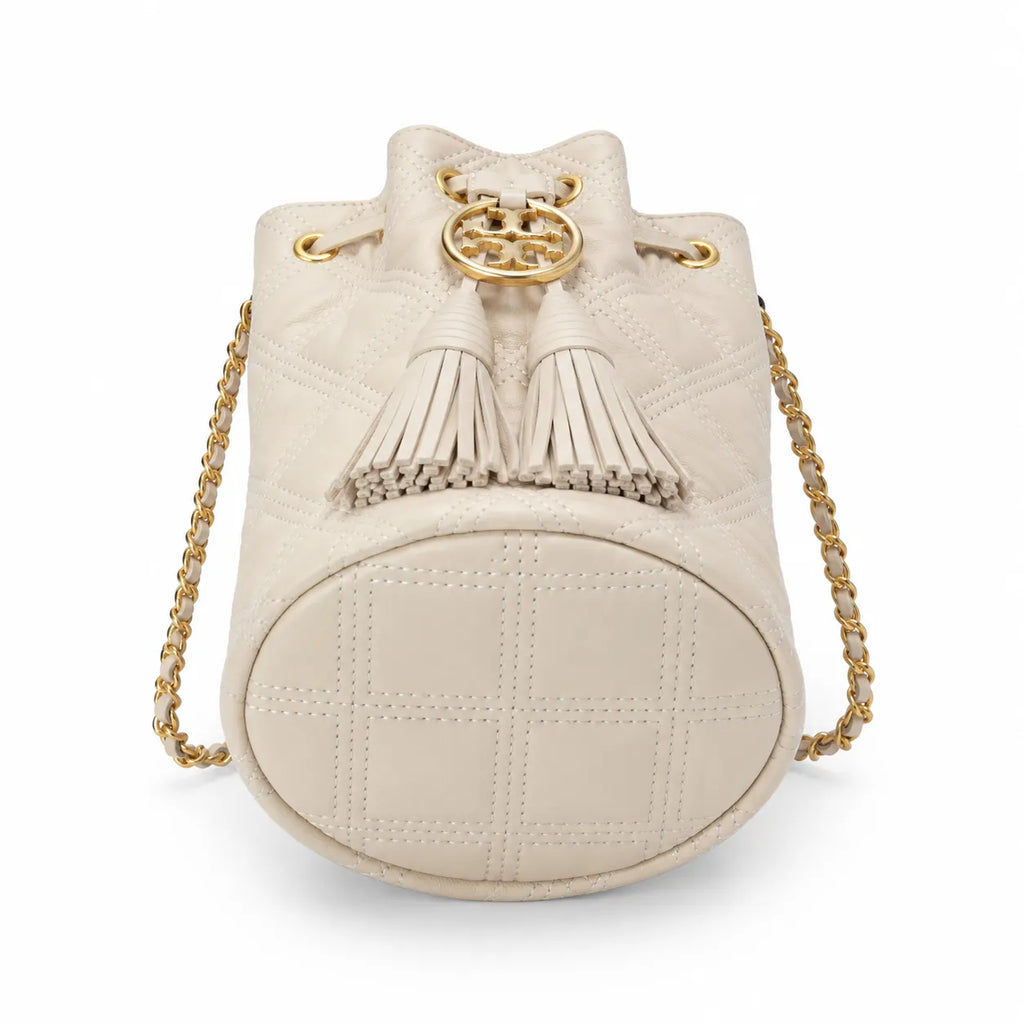 Tory Burch Fleming off-white quilted lambskin with gold logo and tassels  comes with an adjustable chain shoulder strap for multiple carrying options a women's designer handbag
