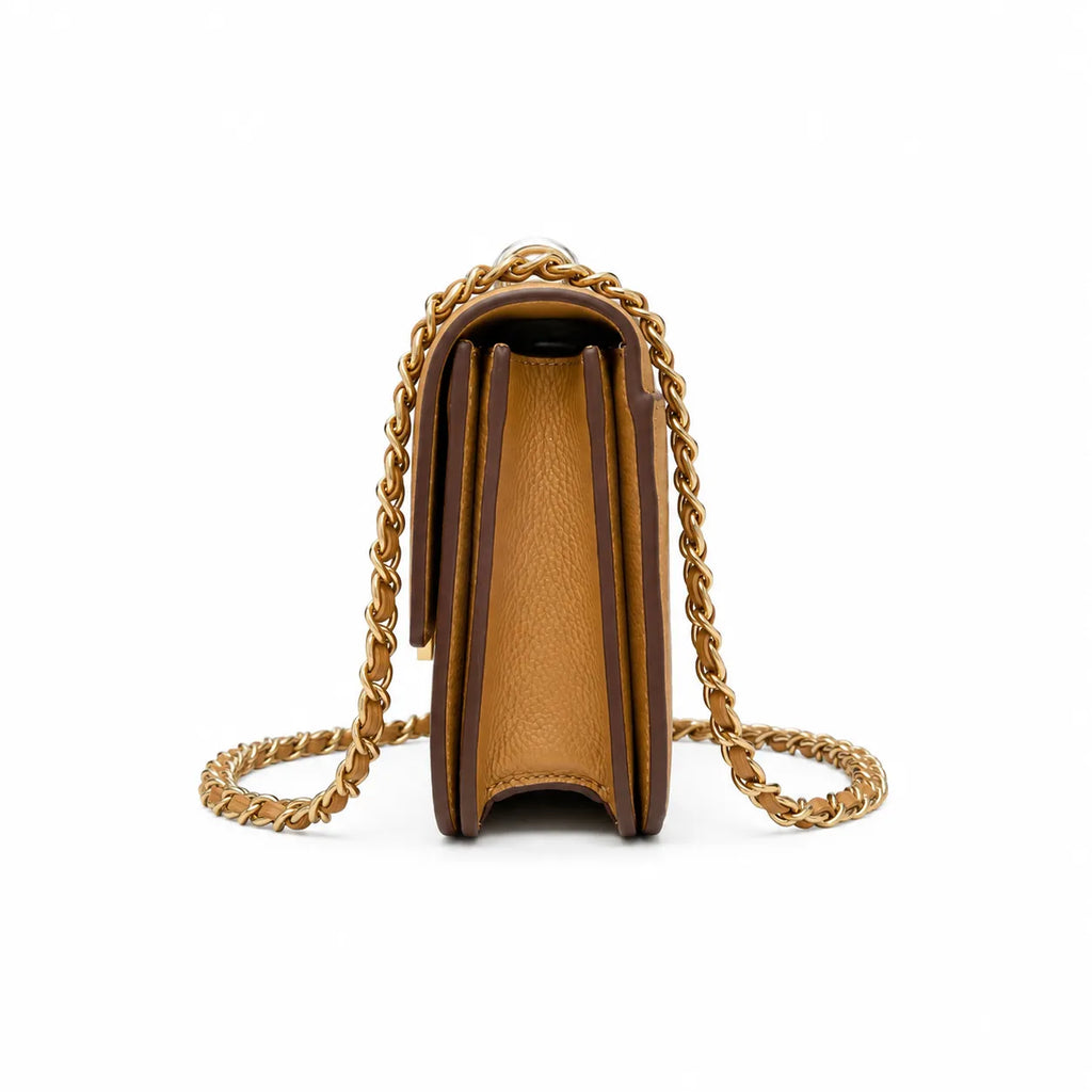 Tory Burch Britten caramel leather handbag with adjustable chain shoulder strap  offering multiple carrying options  A designer handbag for women