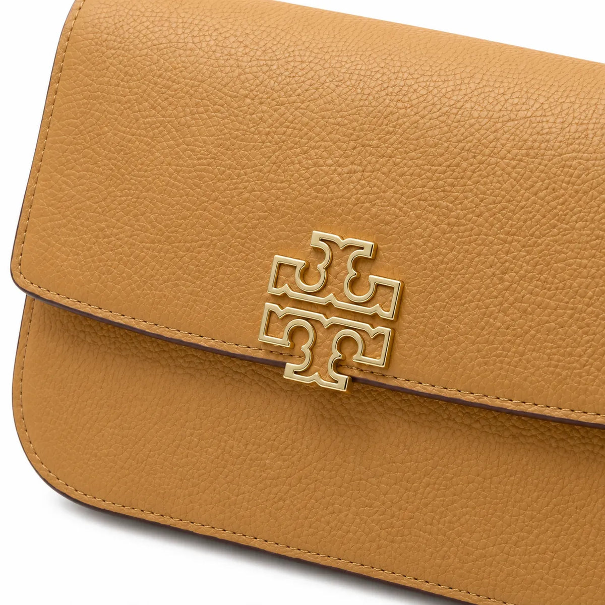Tory Burch Britten caramel leather handbag with adjustable chain shoulder strap  offering multiple carrying options  A designer handbag for women