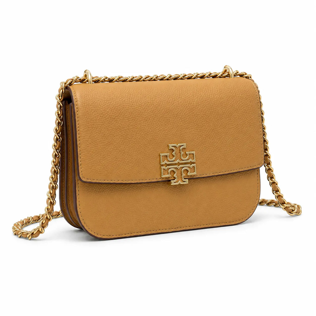 Tory Burch Britten caramel leather handbag with adjustable chain shoulder strap  offering multiple carrying options  A designer handbag for women
