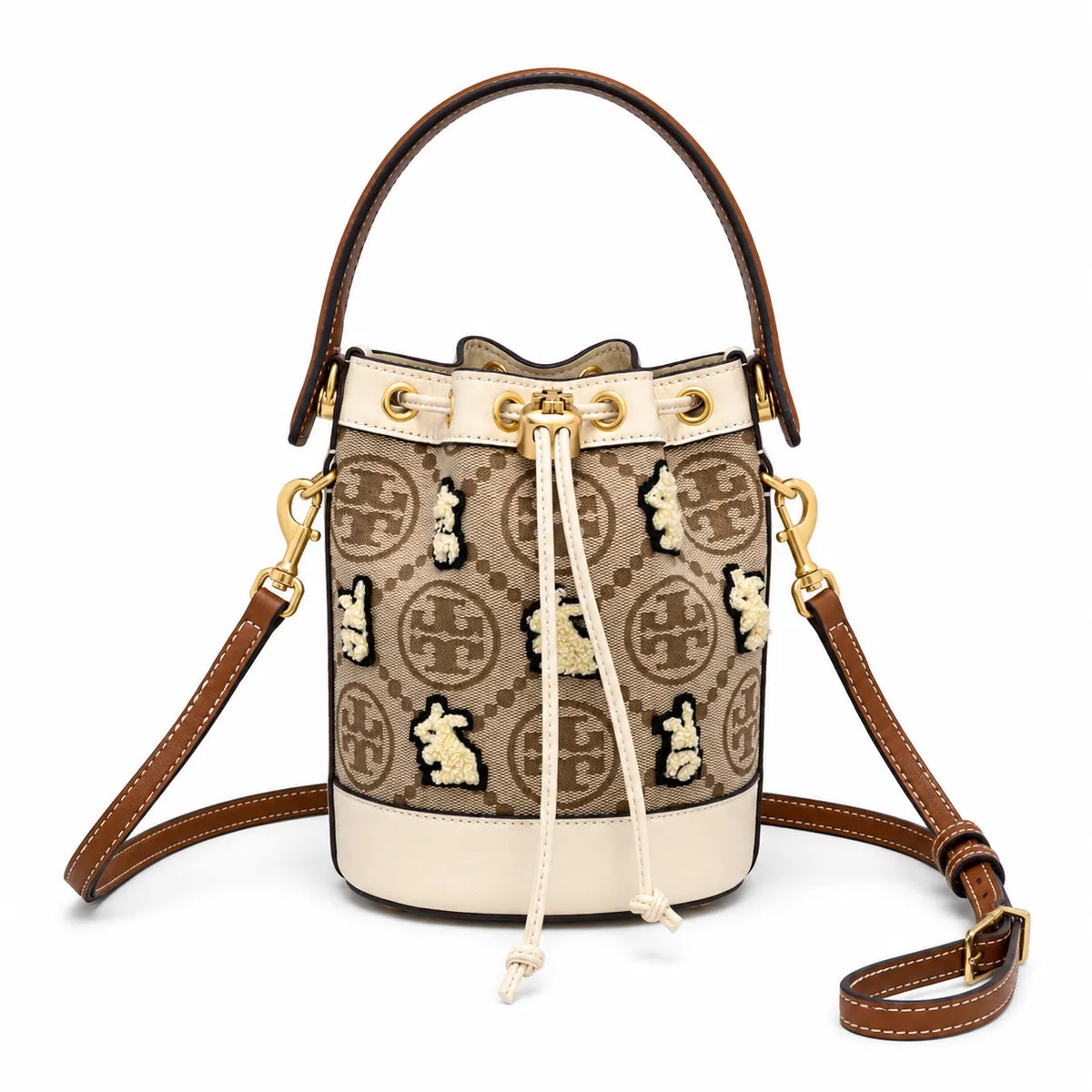 Tory Burch T Monogram | Hazelnut brown Monogram fabric beige leather trim adjustable shoulder strap drawstring closure limited edition women's mini rabbit embroidered bucket bag