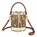 Tory Burch T Monogram | Hazelnut brown Monogram fabric beige leather trim adjustable shoulder strap drawstring closure limited edition women's mini rabbit embroidered bucket bag