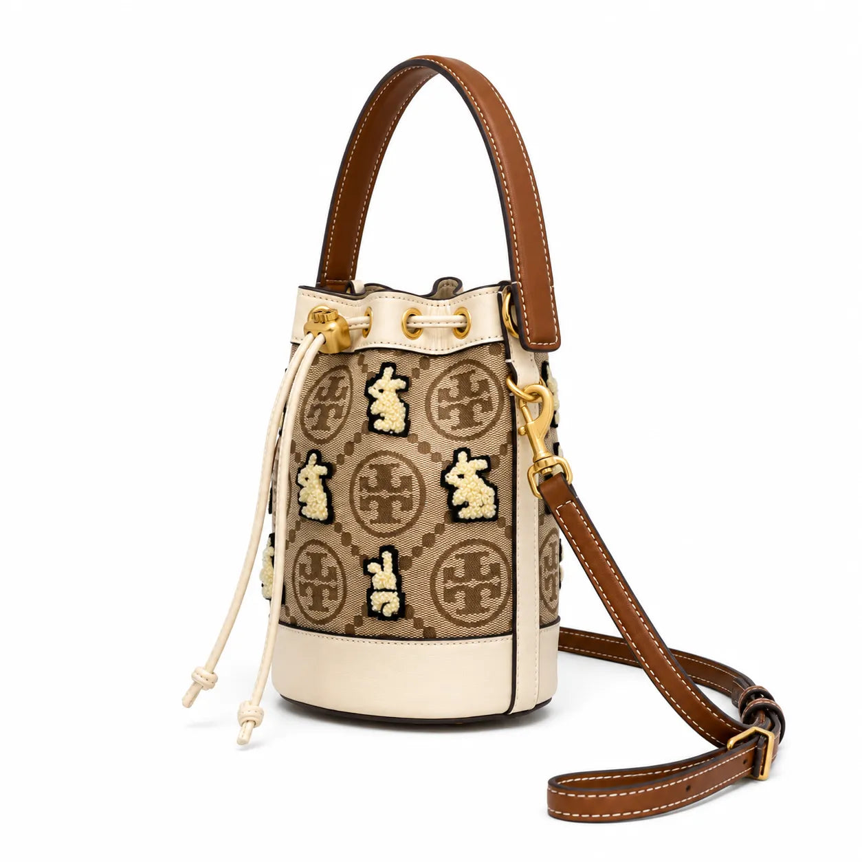 Tory Burch T Monogram | Hazelnut brown Monogram fabric beige leather trim adjustable shoulder strap drawstring closure limited edition women's mini rabbit embroidered bucket bag