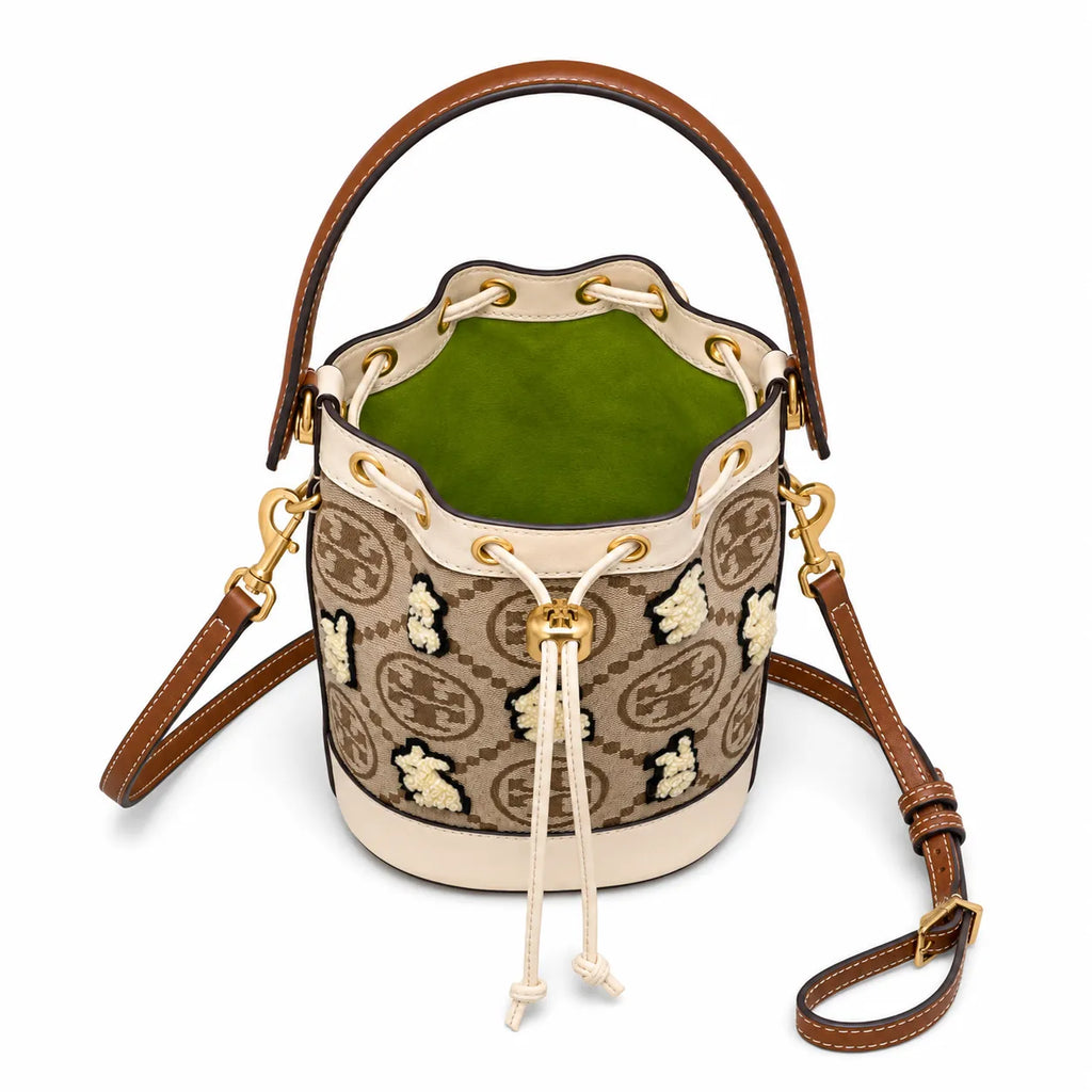 Tory Burch T Monogram | Hazelnut brown Monogram fabric beige leather trim adjustable shoulder strap drawstring closure limited edition women's mini rabbit embroidered bucket bag