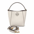 Tory Burch McGraw off-white pebbled leather handbag with adjustable shoulder strap and top handle offering multiple carrying options A women's designer handbag