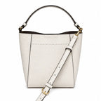 Tory Burch McGraw off-white pebbled leather handbag with adjustable shoulder strap and top handle offering multiple carrying options A women's designer handbag
