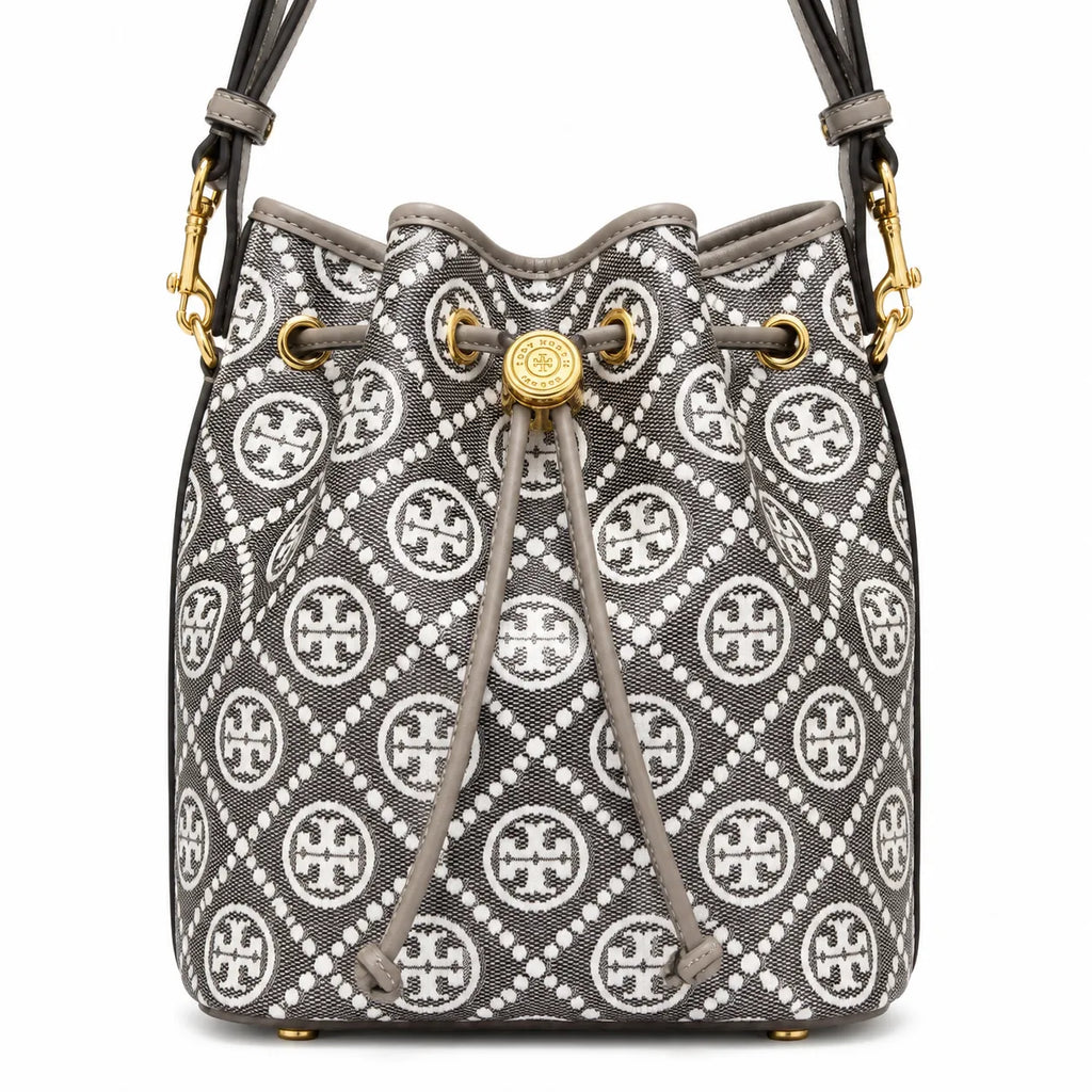 Tory Burch T Monogram bag in grey and white letter jacquard fabric with leather trim drawstring closure and versatile design perfect for commuting and travel