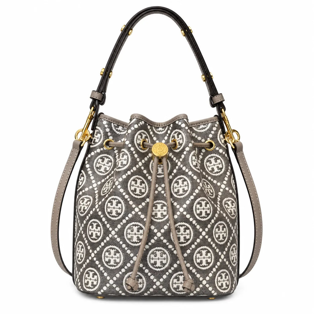 Tory Burch T Monogram bag in grey and white letter jacquard fabric with leather trim drawstring closure and versatile design perfect for commuting and travel