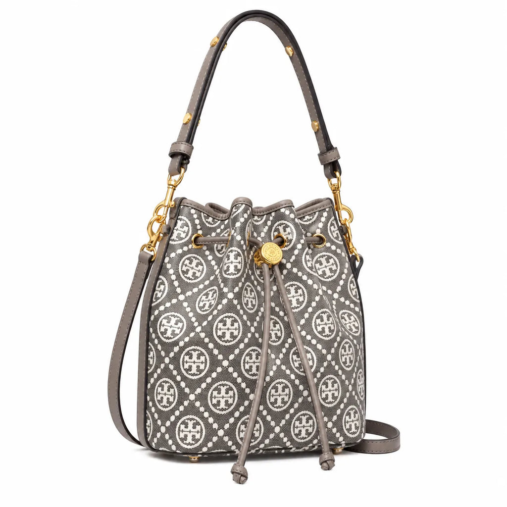 Tory Burch T Monogram bag in grey and white letter jacquard fabric with leather trim drawstring closure and versatile design perfect for commuting and travel