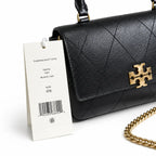 This Tory Burch bag in black leather features a detachable chain shoulder strap and top handle and can be converted into a shoulder bag or crossbody bag for women