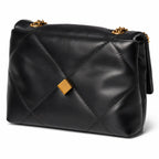 Tory Burch Kira in black calfskin with a gold double-T adjustable chain shoulder strap offering multiple carrying options for women