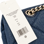 Tory Burch Kira navy blue denim with a silver double-T gold twisted chain shoulder strap offering multiple carrying options for women