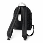 Tory Burch Ella a lightweight travel and commuter bag adorned with a silver double-T logo and an adjustable shoulder strap