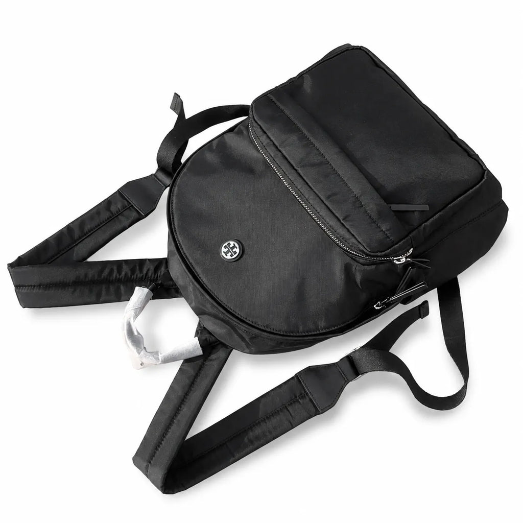 Tory Burch Ella a lightweight travel and commuter bag adorned with a silver double-T logo and an adjustable shoulder strap