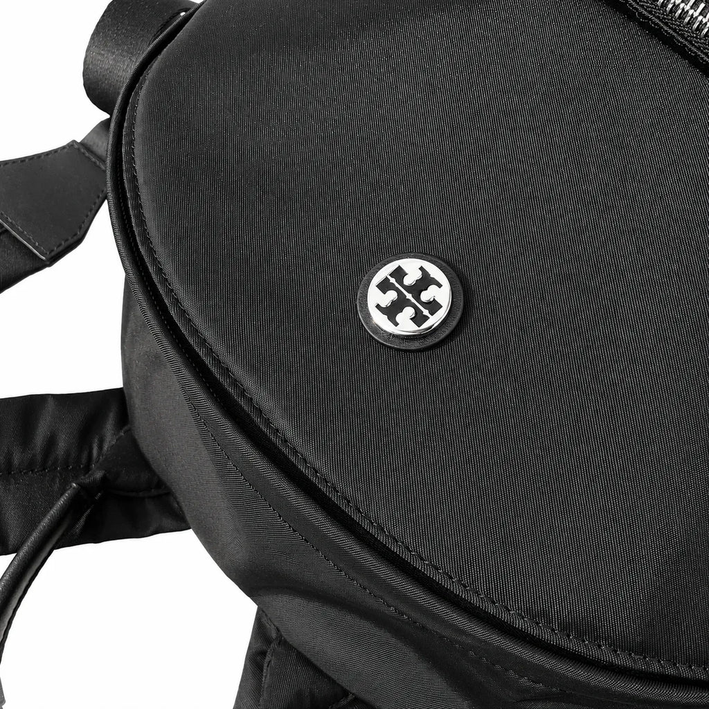 Tory Burch Ella a lightweight travel and commuter bag adorned with a silver double-T logo and an adjustable shoulder strap