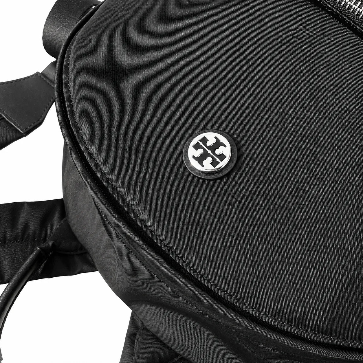 Tory Burch Ella a lightweight travel and commuter bag adorned with a silver double-T logo and an adjustable shoulder strap