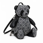 Tory Burch T-strap canvas and black faux leather teddy bear backpack  playful yet stylish  Suitable for women and teenagers