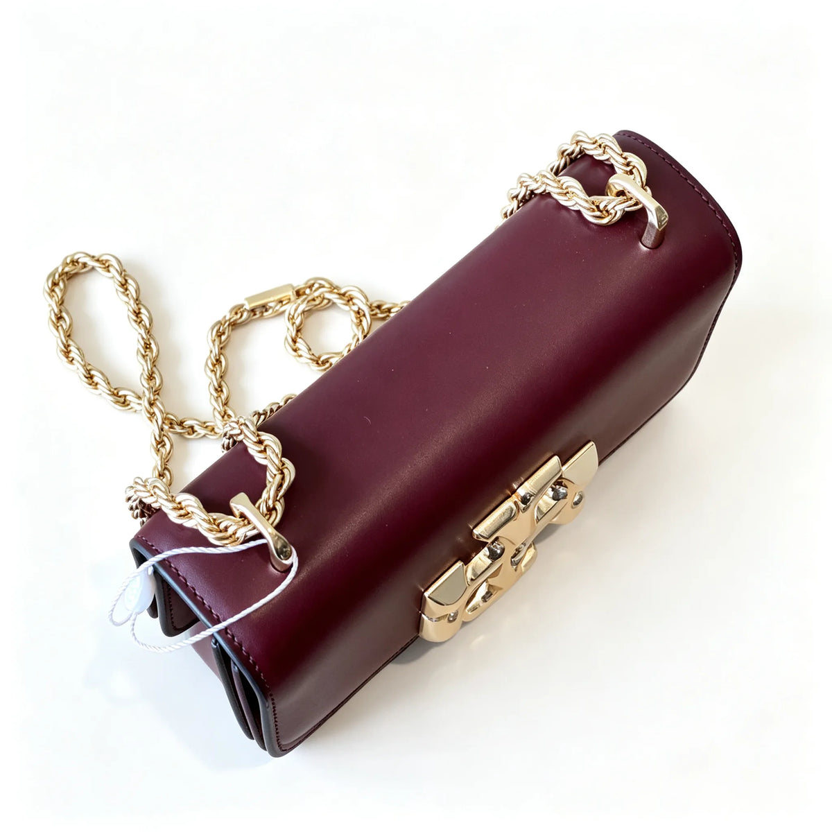 Tory Burch Eleanor burgundy with a gold double-T adjustable twist chain shoulder strap offering multiple carrying options for women