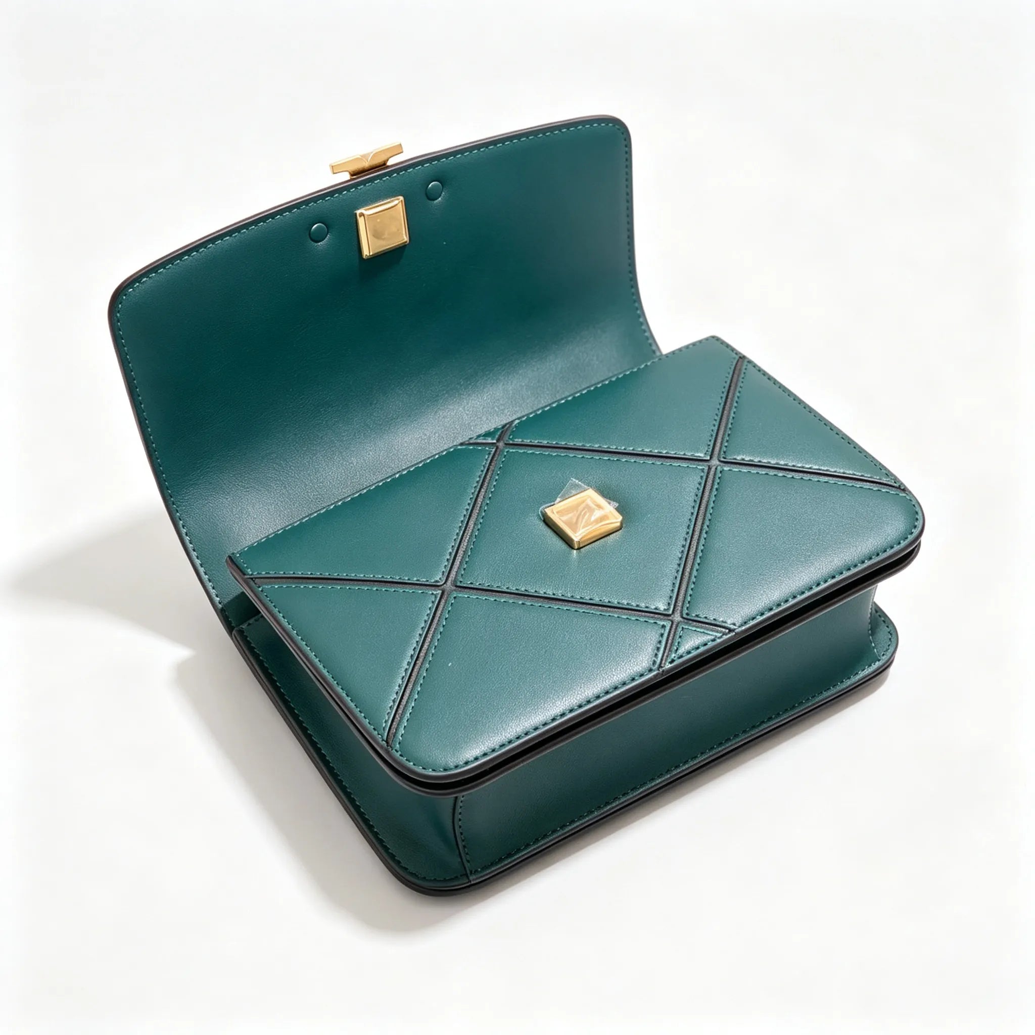 Tory Burch Eleanor in deep sea green with a gold double-T adjustable twist chain shoulder strap offering multiple carrying options for women