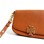 Tory Burch Britten caramel brown adjustable shoulder strap and zippered lining a small everyday bag for women