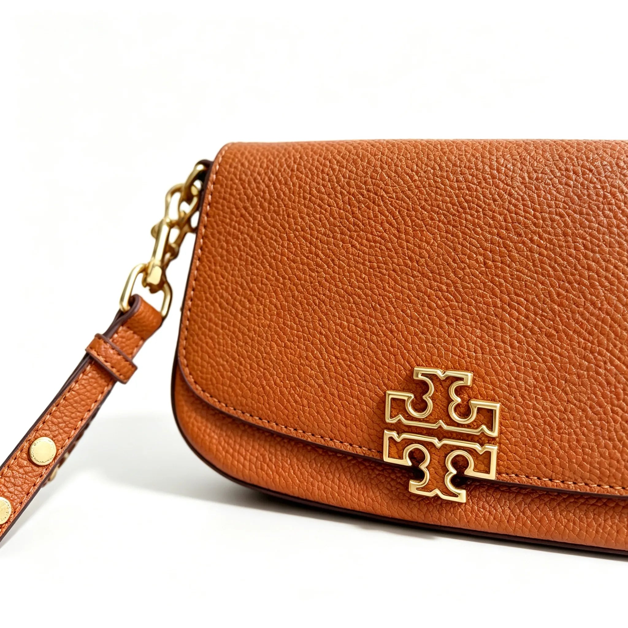 Tory Burch Britten caramel brown adjustable shoulder strap and zippered lining a small everyday bag for women