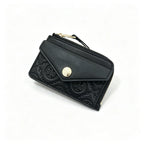 Tory Burch | Black embossed leather  multi-card slot design comes with a detachable wrist strap compact and portable  suitable for everyday use and travel
