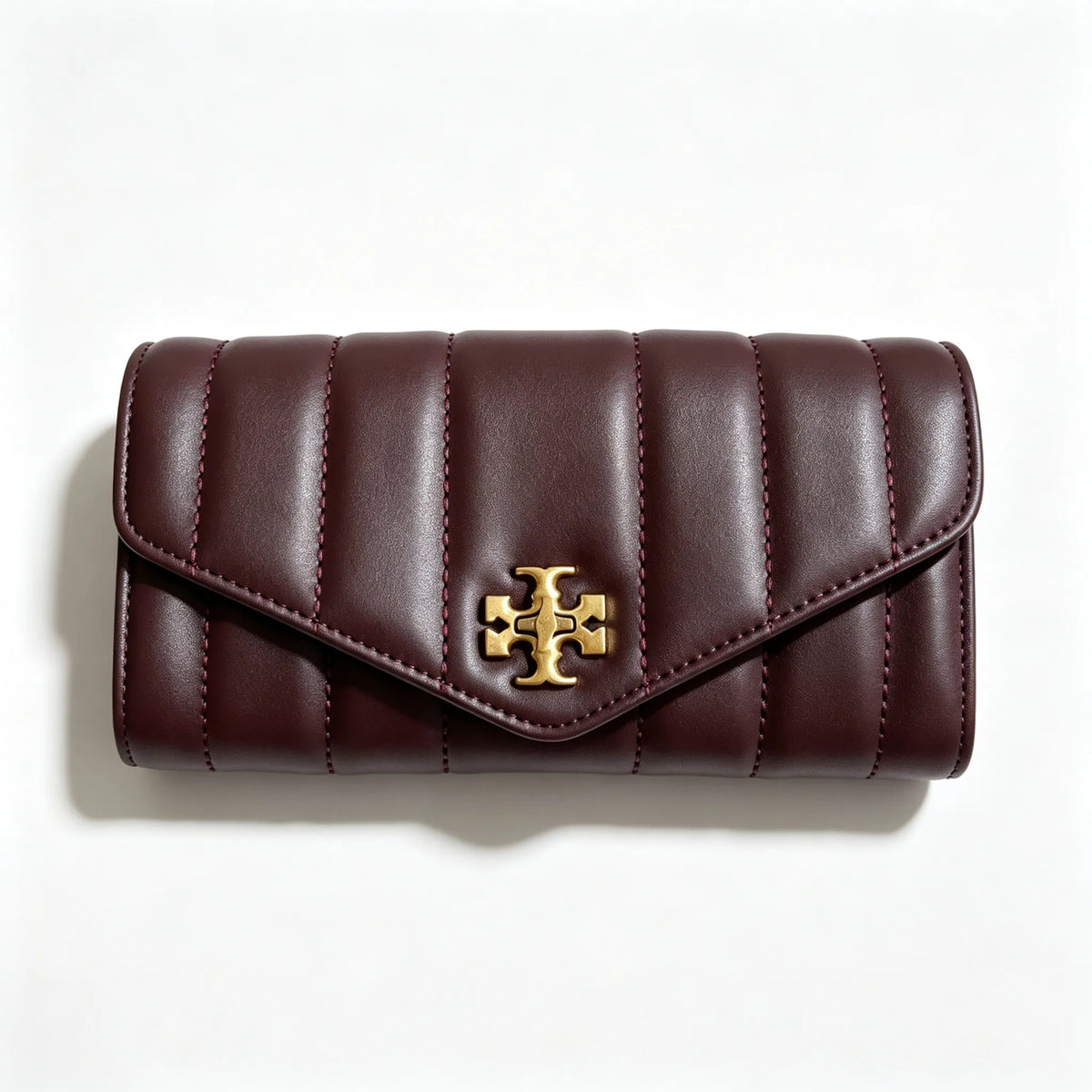 Tory Burch Kira burgundy quilted Nappa leather clutch with multiple card slots and a zippered coin purse