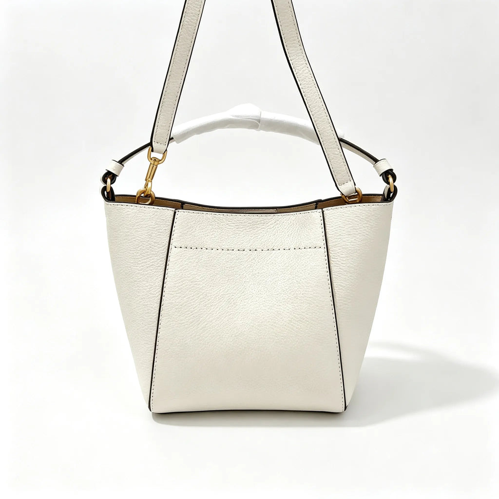 Tory Burch McGraw | Off-white pebbled leather with an adjustable shoulder strap and top handle  offering multiple carrying options  A women's designer handbag  perfect for work and weekend getaways