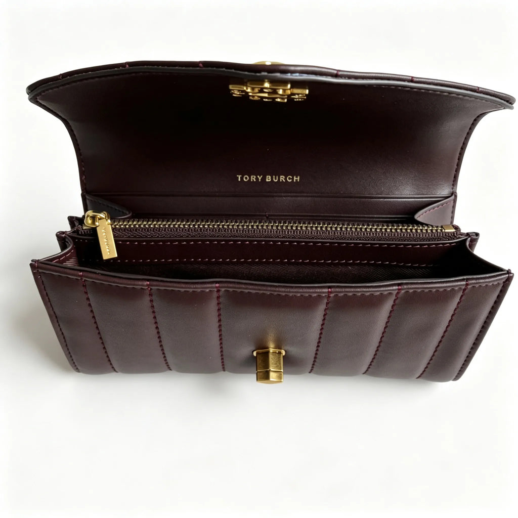 Tory Burch Kira burgundy quilted Nappa leather clutch with multiple card slots and a zippered coin purse