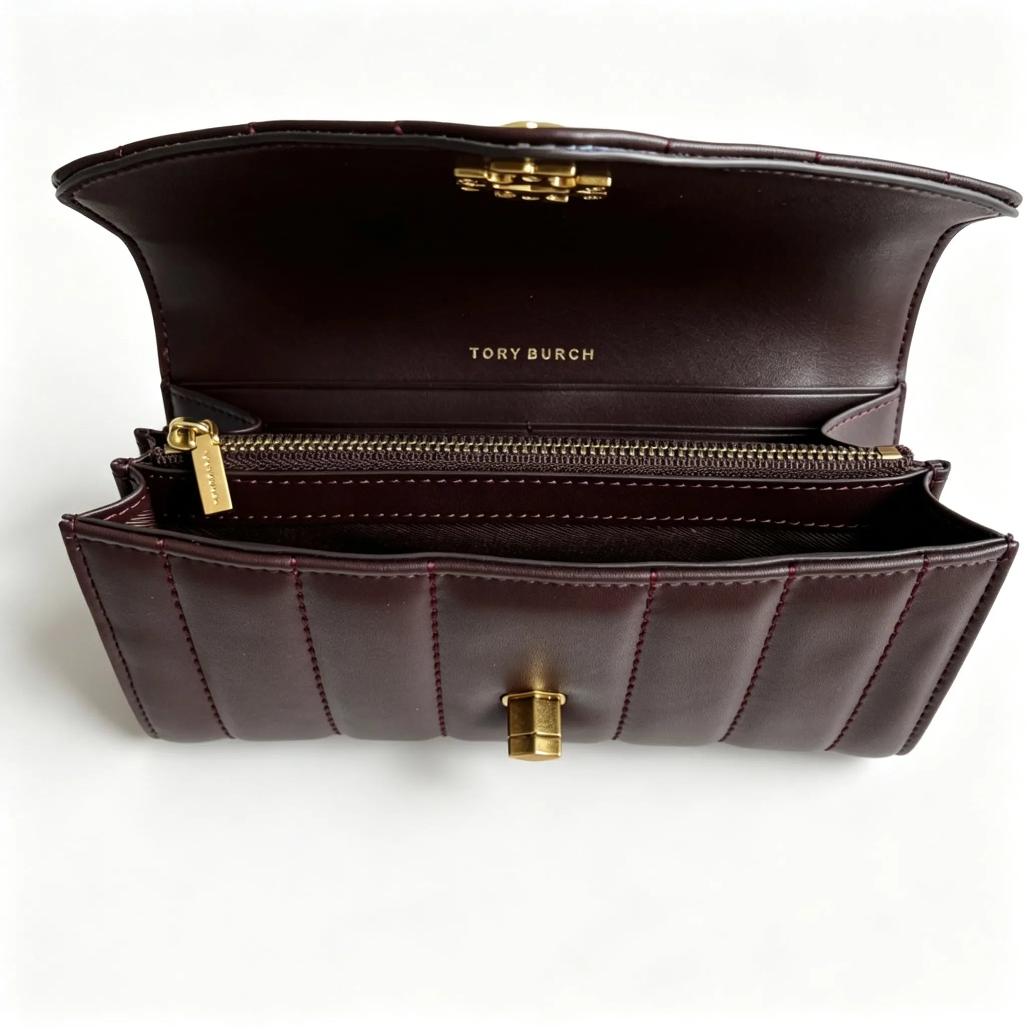 Tory Burch Kira burgundy quilted Nappa leather clutch with multiple card slots and a zippered coin purse