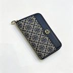 Tory Burch T Monogram wallet in navy and beige Monogram canvas, long with multiple card slots and a zipper