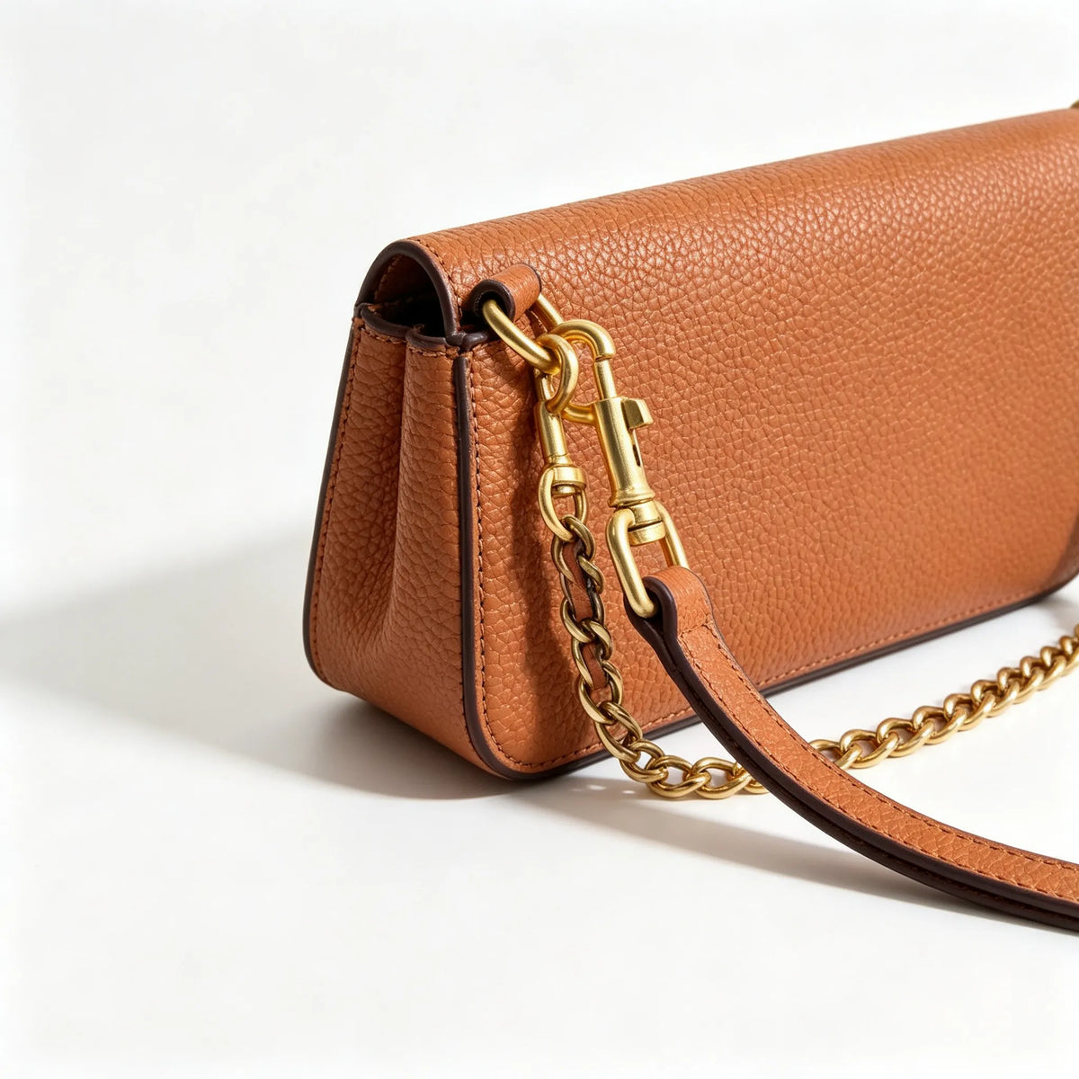 Tory Burch Britten caramel brown adjustable shoulder strap and zippered lining a small everyday bag for women
