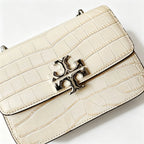 Tory Burch Eleanor off-white embossed leather twisted chain shoulder strap multiple carrying options for women