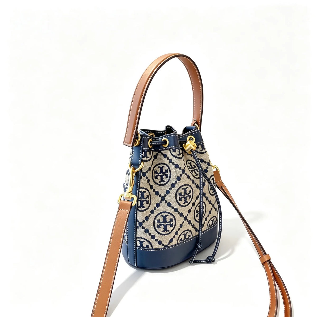 Tory Burch T Monogram | Navy blue and beige Monogram fabric leather trim  adjustable shoulder strap drawstring closure  women's designer mini jacquard bucket bag