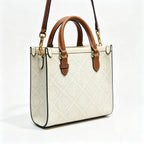Tory Burch T Monogram | Off-white embossed canvas with brown leather trim detachable shoulder strap  women's designer mini handbag