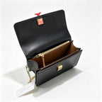 Tory Burch Eleanor | Black leather adjustable chain shoulder strap multiple carrying options women's designer handbag